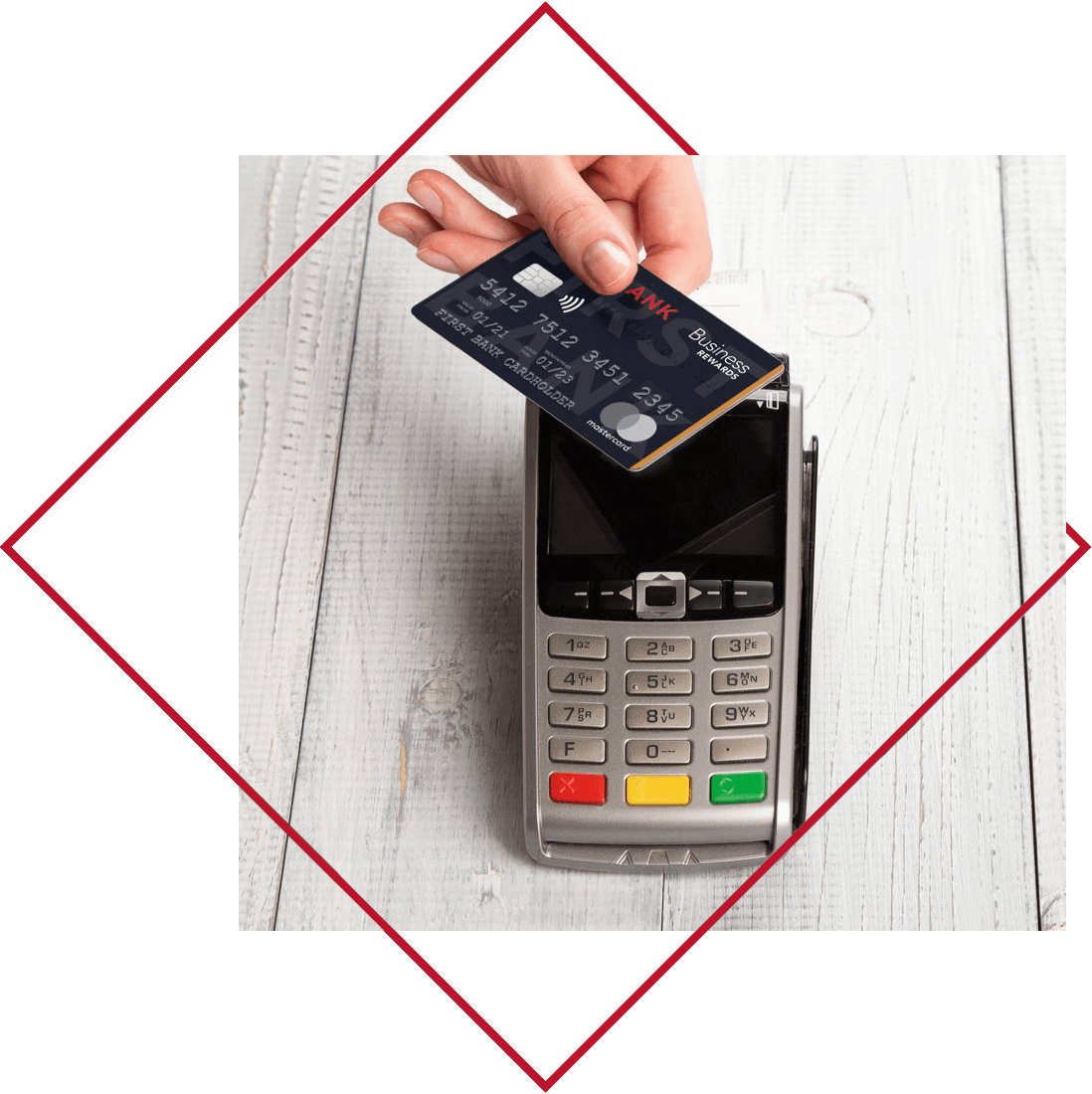 Crawfield Credit Union Credit Card with Rewards being used on touchless payment pad.